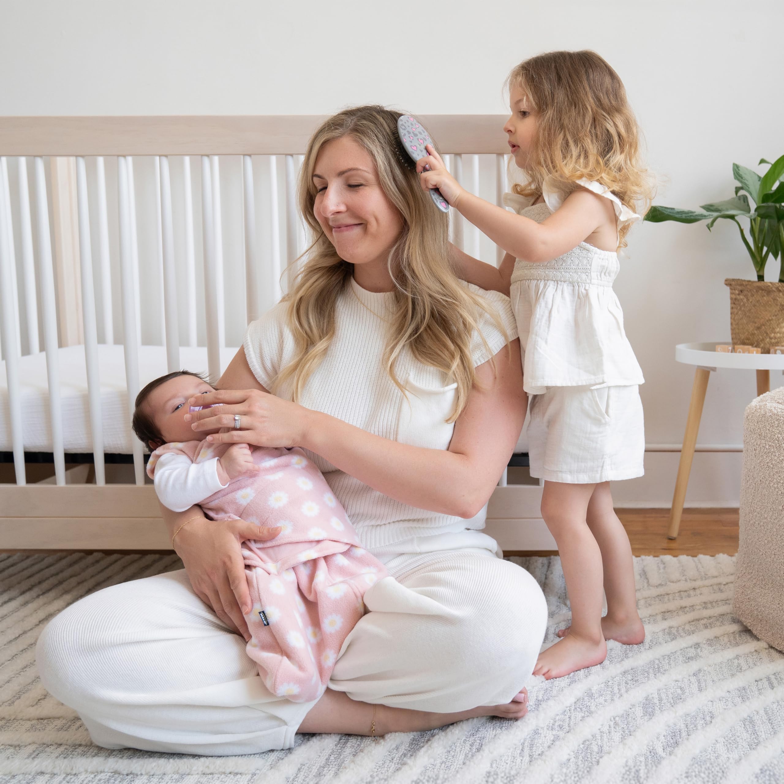 HALO Sleepsack Swaddle armed-in-use shows snug fit for newborns.