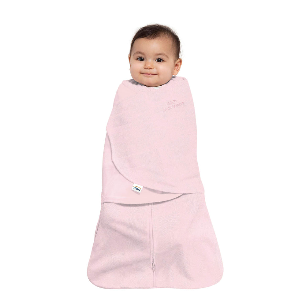 HALO Sleepsack Swaddle hands-to-face shows versatile sleep positions for newborns.