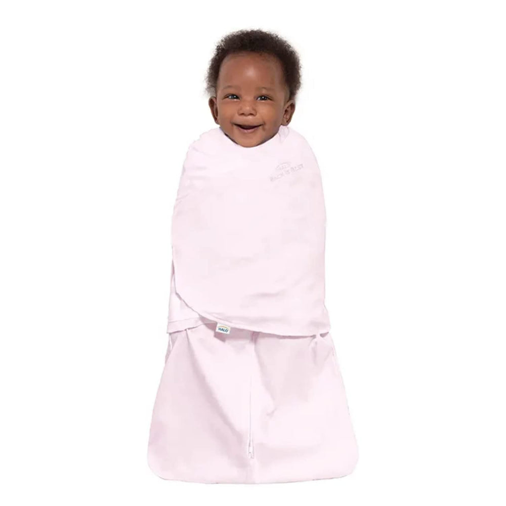 HALO Sleepsack Swaddle in pink, side view, flexible fit for comfort.