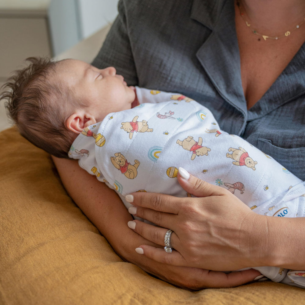 Halo Winnie Rainbows Sleepsack uses an inverted zipper for easy diaper changes.