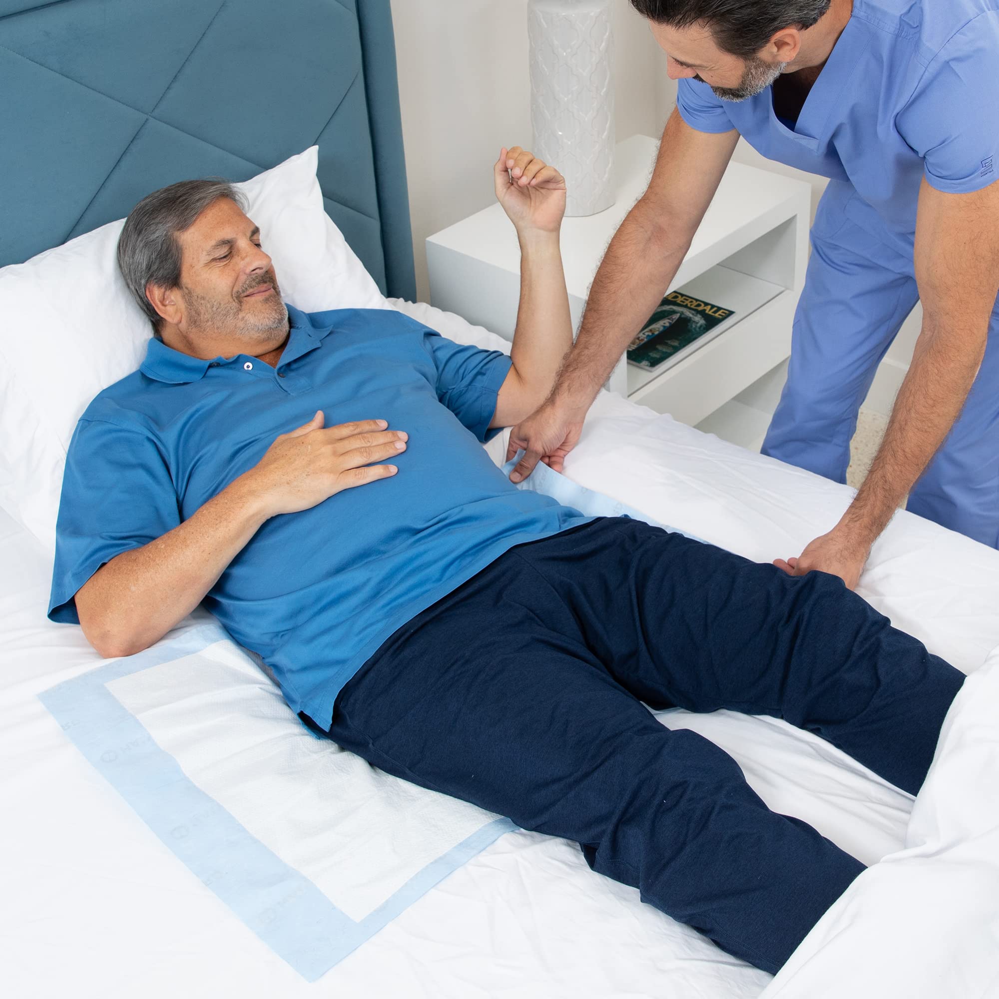 HALYARD underpads in a bed setup demonstrate easy placement and repositioning for care