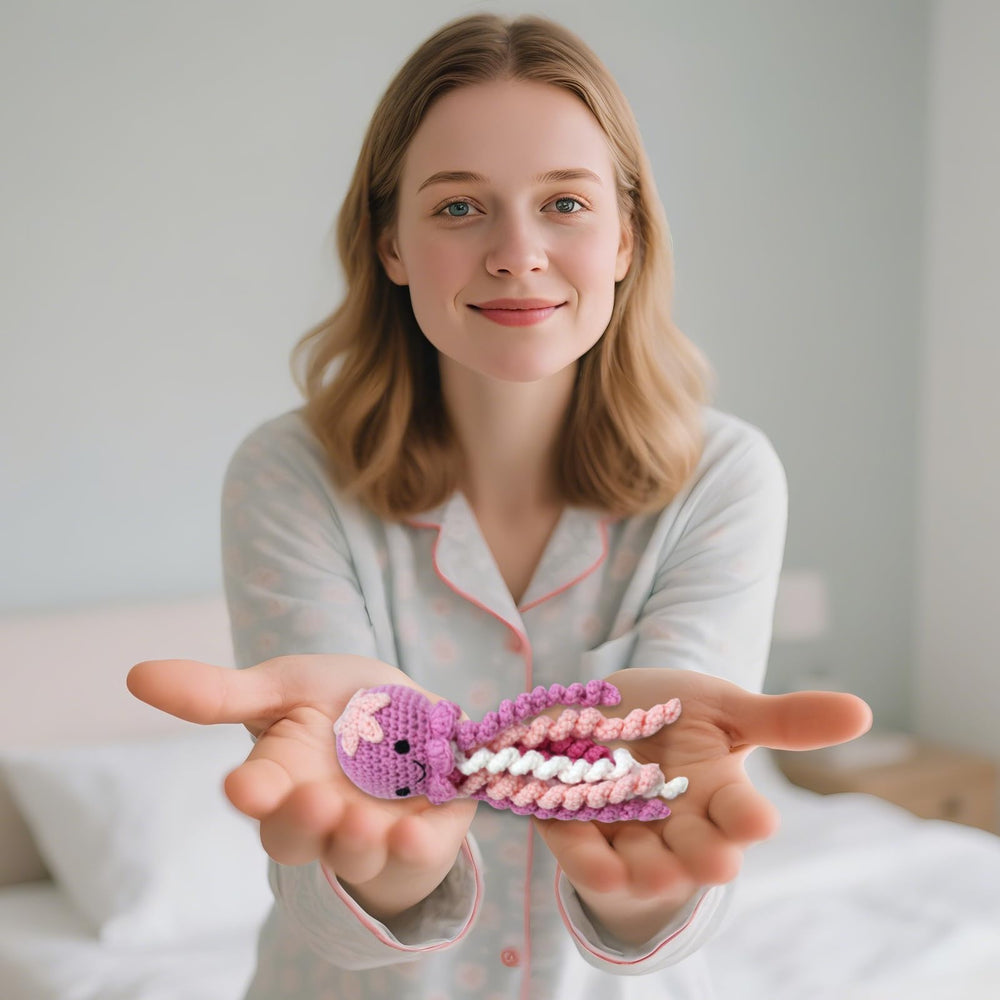 Machine-washable crochet octopus for easy cleaning and reuse.
