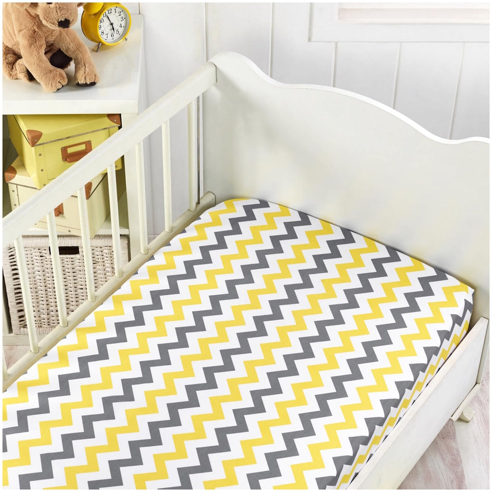 Handywa fitted crib sheet with white base and yellow-gray print for versatile nursery styling