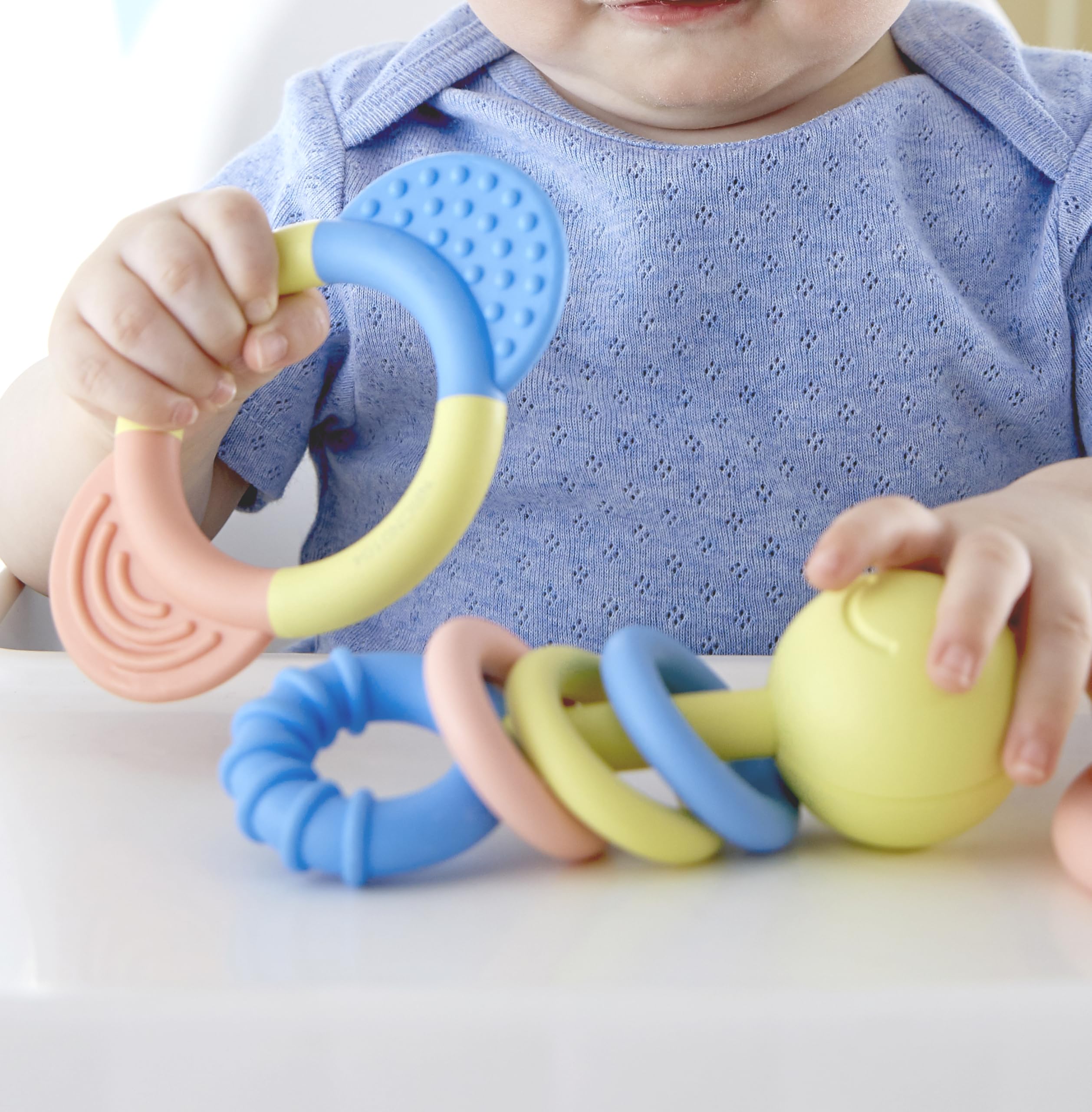 Hape ring rattle encouraging play with gentle sounds during early exploration