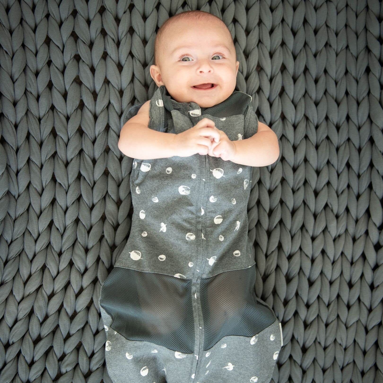 Happiest Baby Sleepea escape-proof Velcro secures snug swaddle and prevents self-unswaddling.
