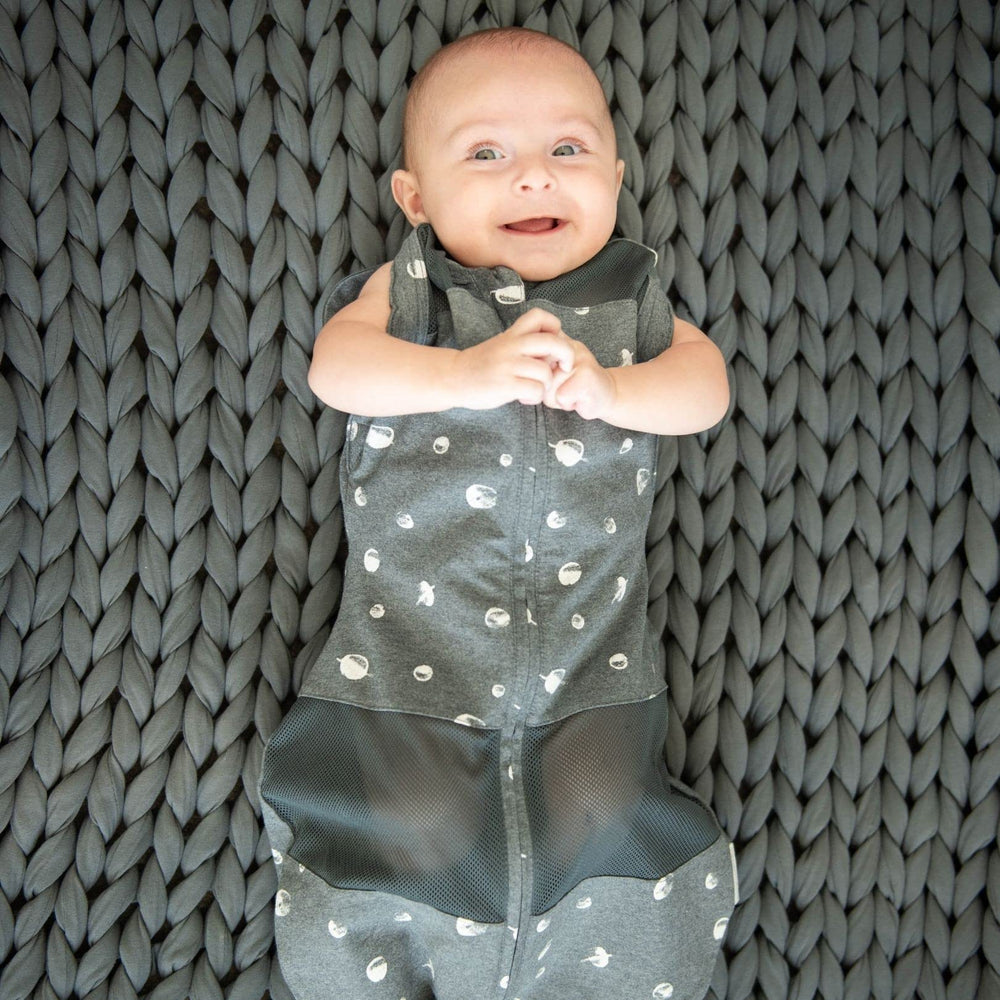 Happiest Baby Sleepea escape-proof Velcro secures snug swaddle and prevents self-unswaddling.