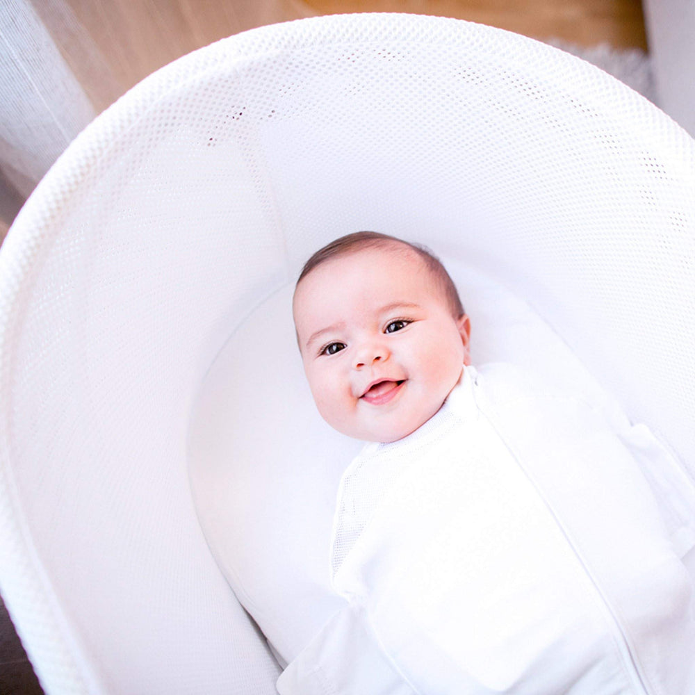 Happiest Baby SNOO Sleep Sack teal planets 3-pack on display for bundle option.