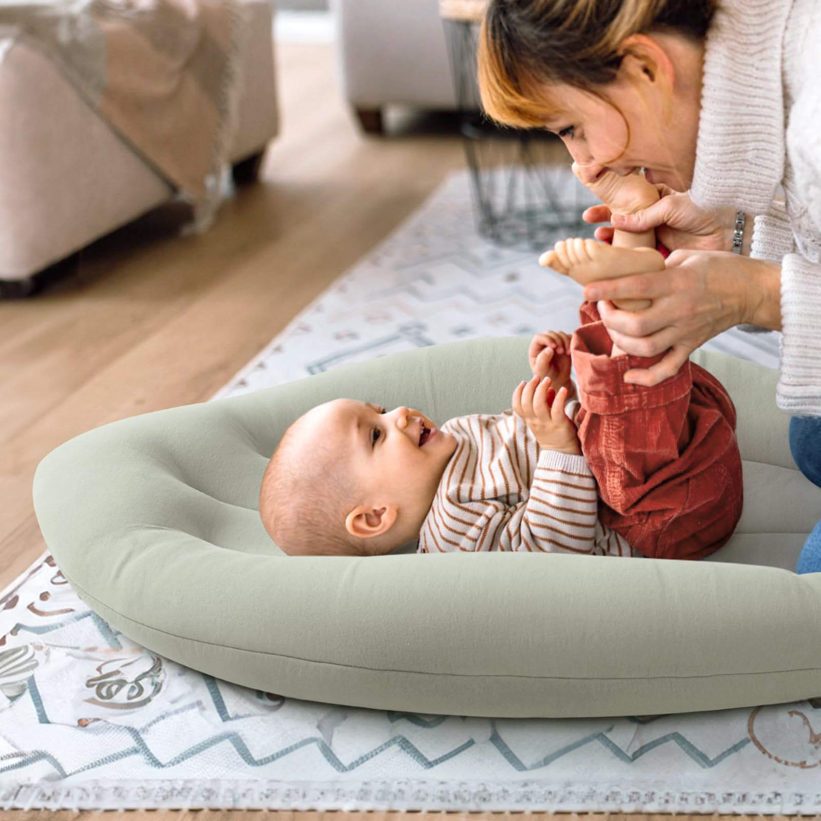 Happle sunny baby lounger side view demonstrates secure support during supervised play