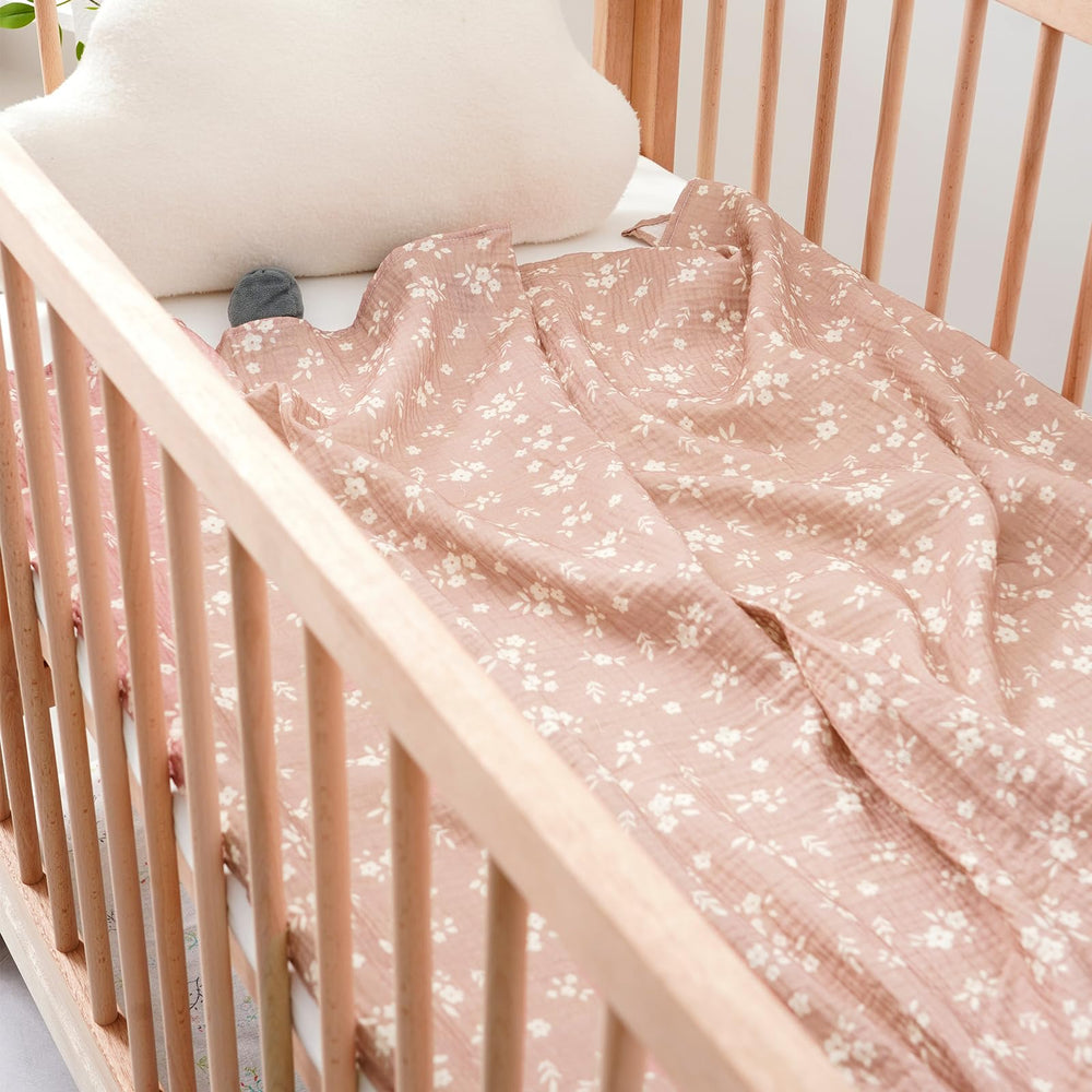 Gender-neutral flower pattern on Happy Flute swaddle blankets suits both girls and boys.