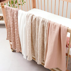 Closeup of newborn swaddle on Happy Flute set shows soft edges for secure wrapping.