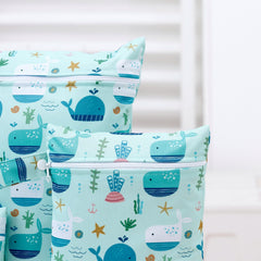 Happy Flute wet bag for travel folds flat to save luggage space.