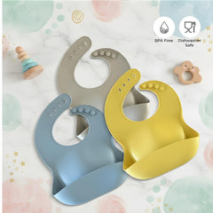 Happy Snails roll-up travel bib showing foldable design for easy packing on trips