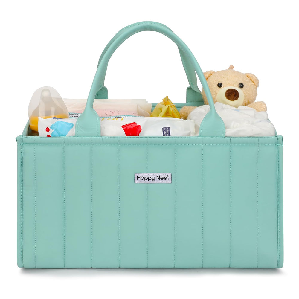 HAPPY NEST mint green diaper caddy keeps diapers and wipes within easy reach.