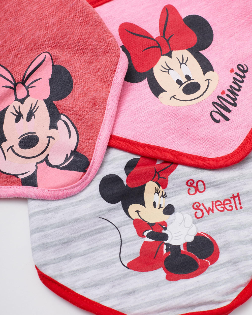 Happy Threads baby wearing Minnie bib during feeding demonstrates comfortable fit and splash coverage