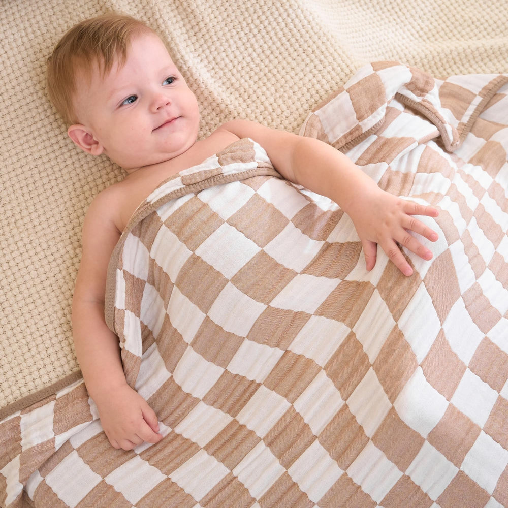 HardNok Ultra Soft Muslin Blanket stroller cover providing breathable shade on outings.