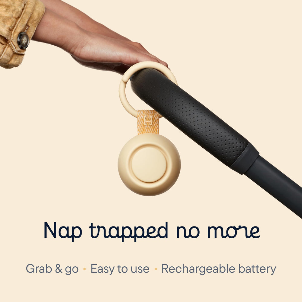 Hatch Go clipped to a stroller for easy travel and quick naps.