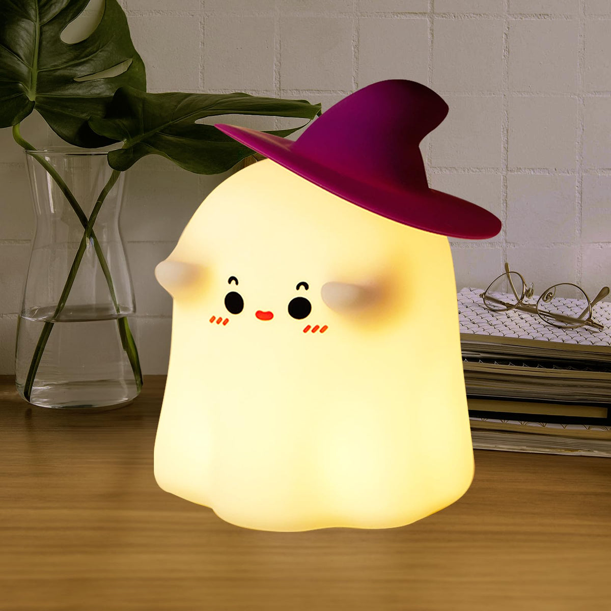 Hbaushun Ghost Night Light on a bedside table, providing a gentle, comforting glow.