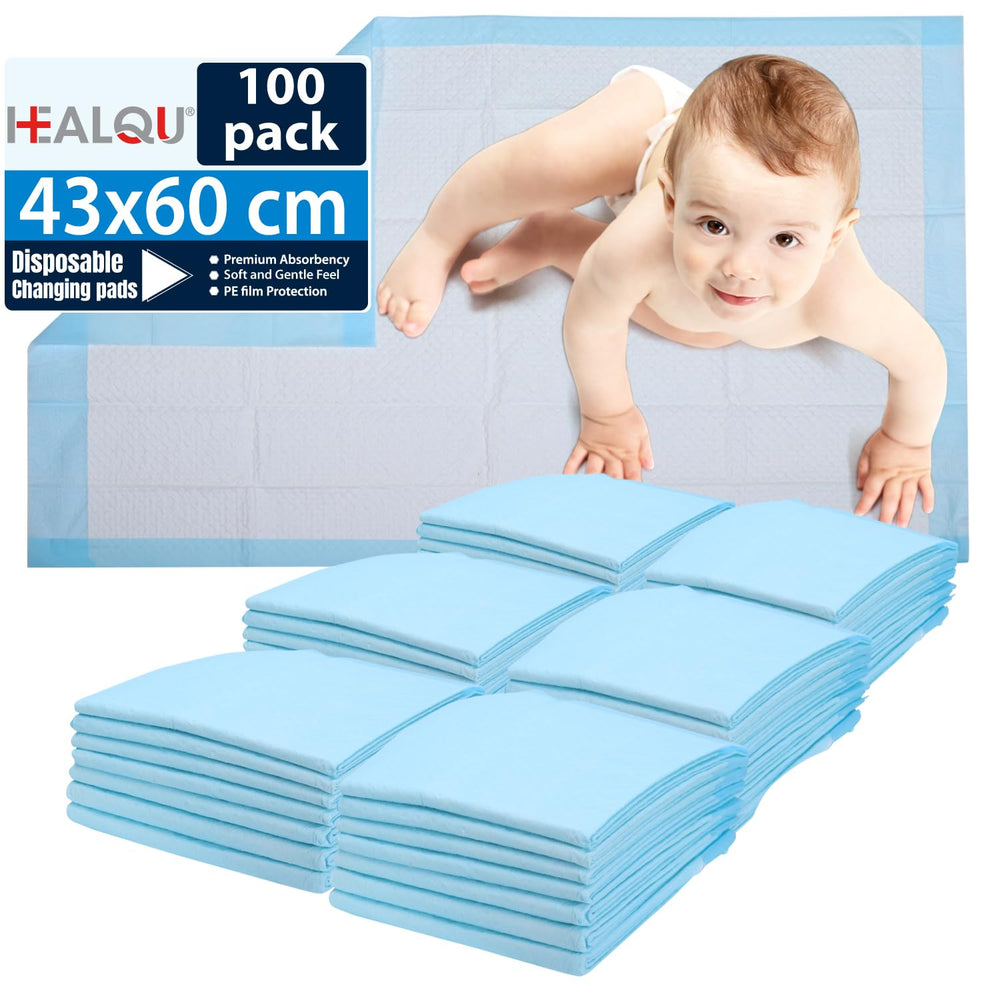Healqu changing pad liner on a table with full coverage, protecting surfaces during diaper changes.