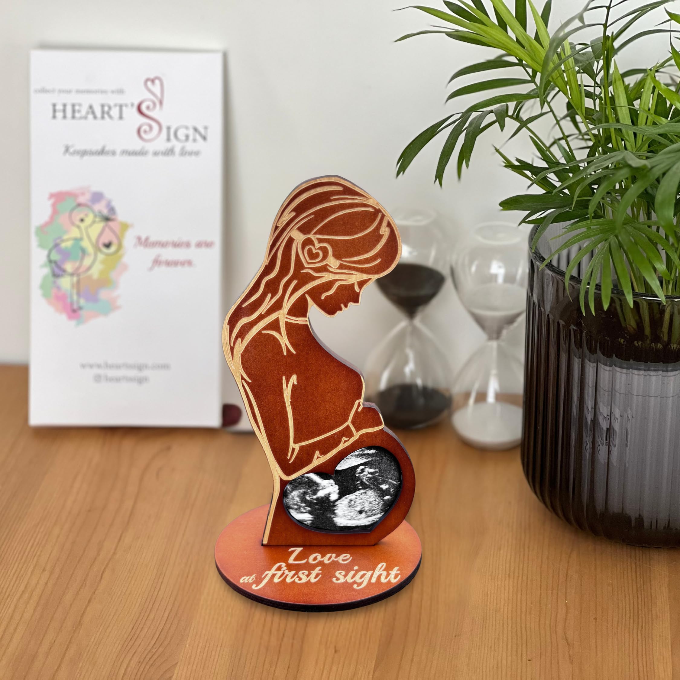 Heart's Sign brown wood frame engraving detail highlighting laser design.