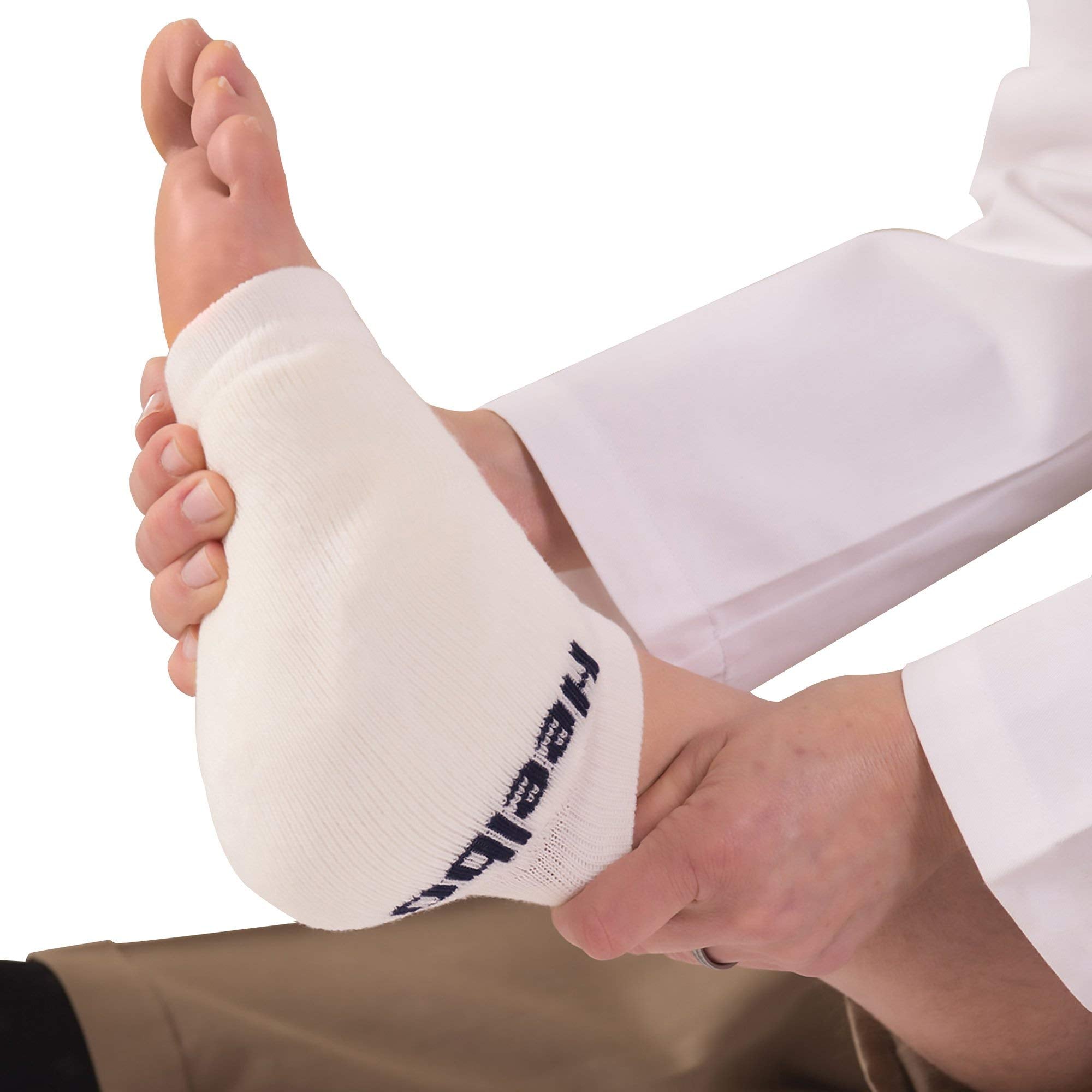 Heelbo foam pad close-up reveals contoured cushioning for protection.