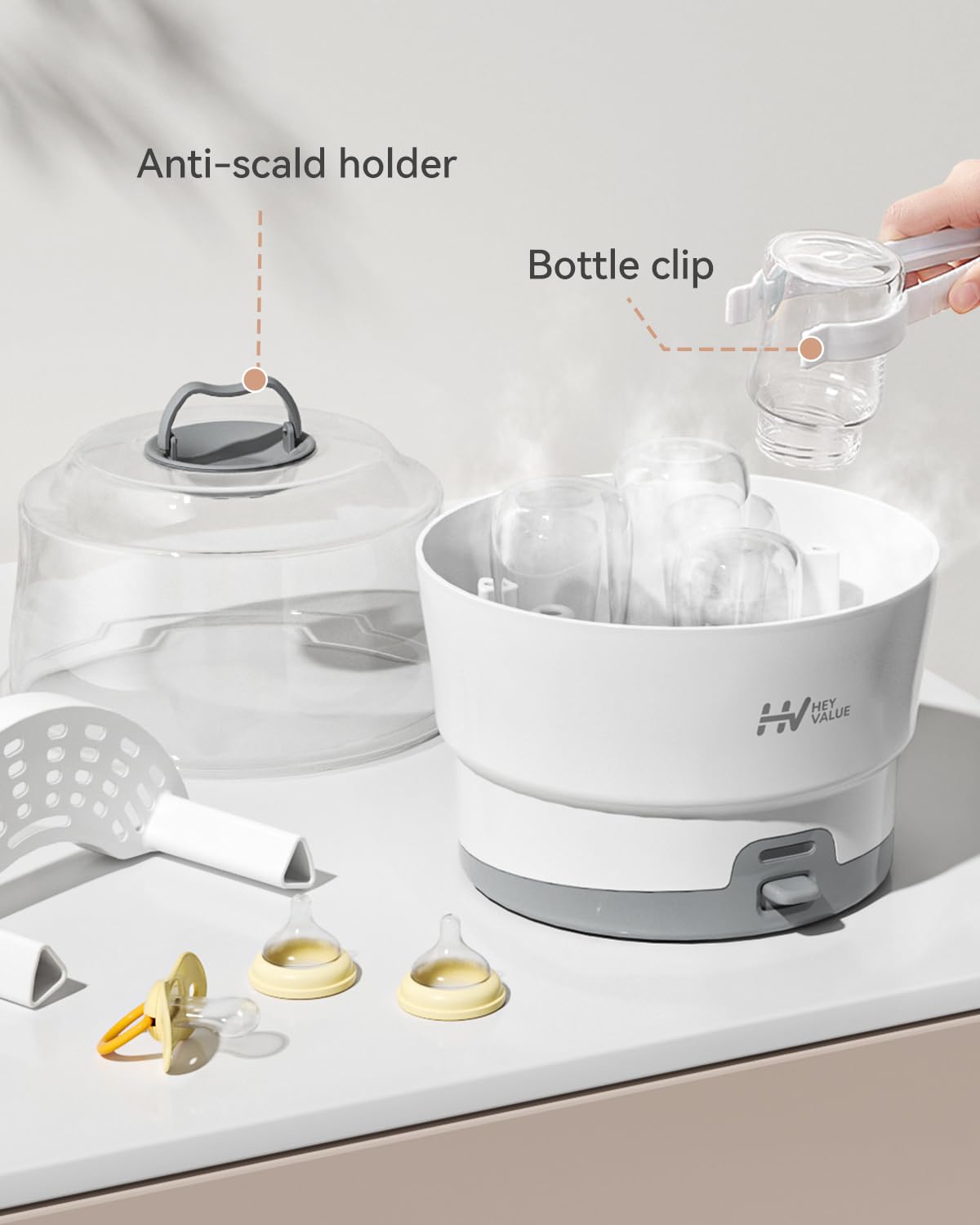 HEYVALUE Ease-Steam tongs included for safe post-sterilization handling.