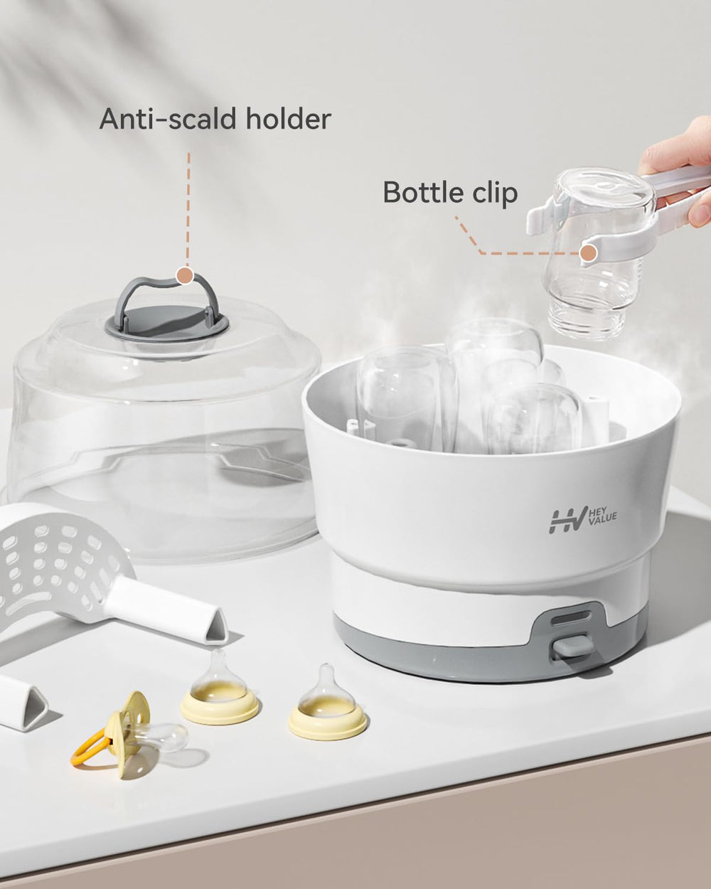 HEYVALUE Ease-Steam tongs included for safe post-sterilization handling.