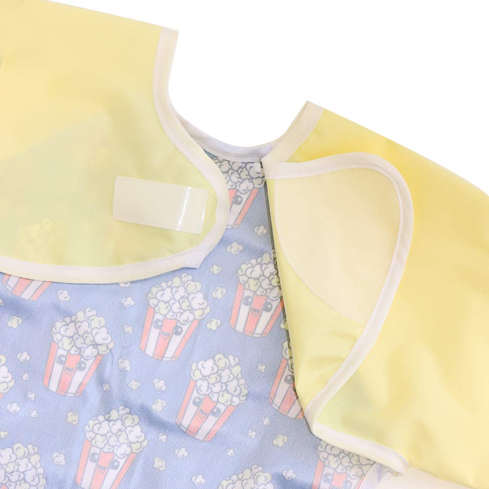 Hi Sprout sleeve bib features a catch-all pocket to keep messes off the floor.