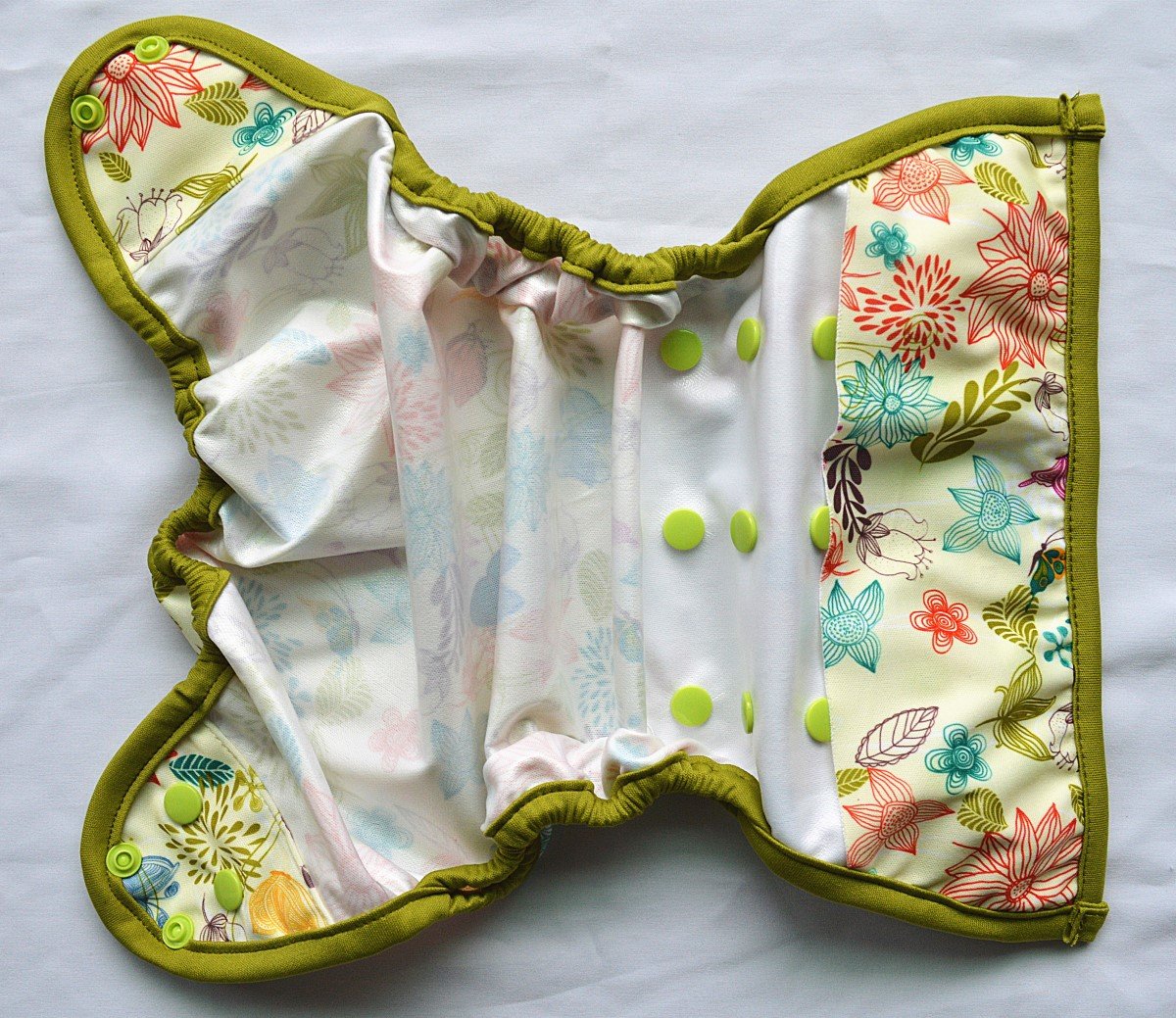 Hibaby Bloom diaper cover worn on baby for flexible sizing.
