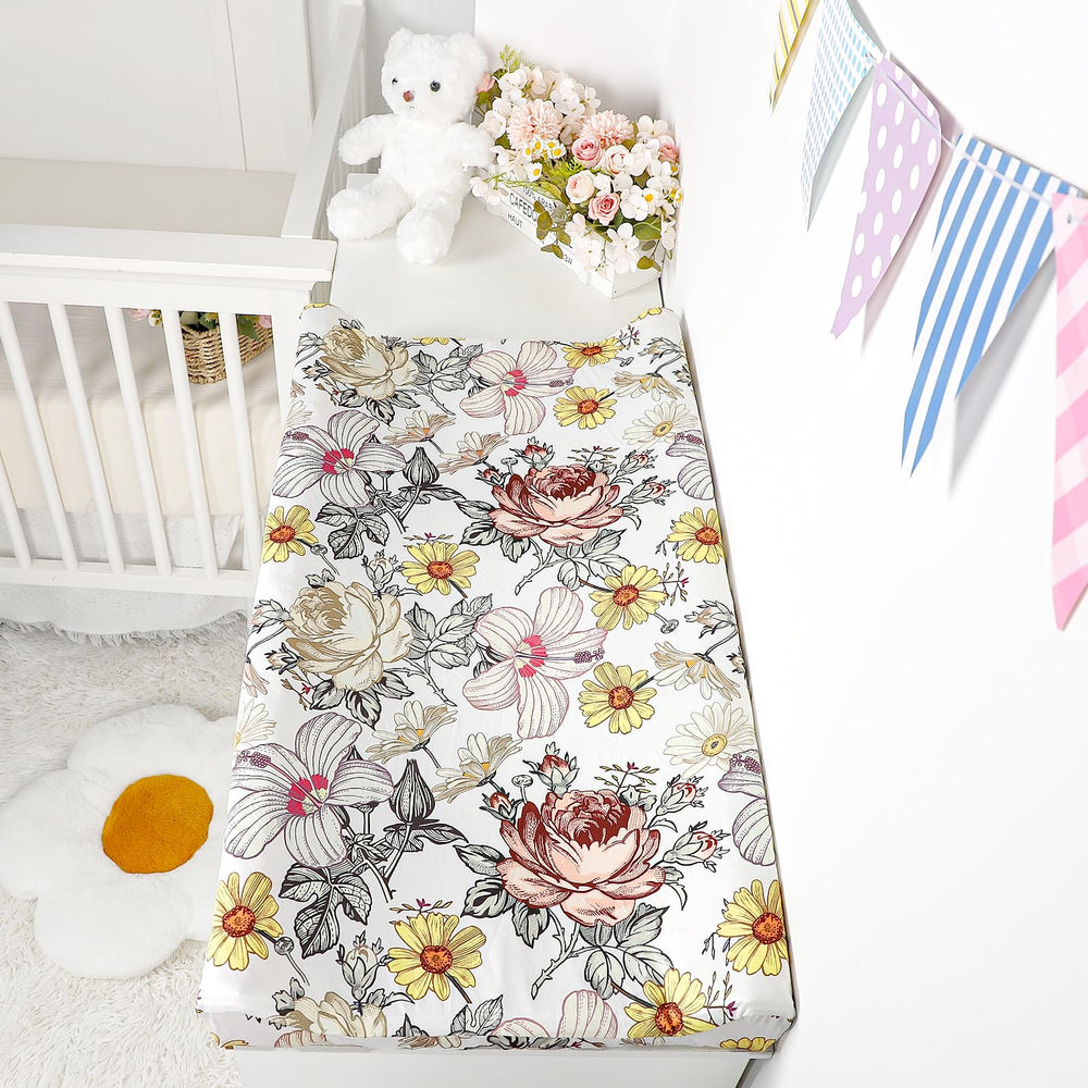 HNHUAMING floral design covers a standard pad and coordinates with various nursery styles.