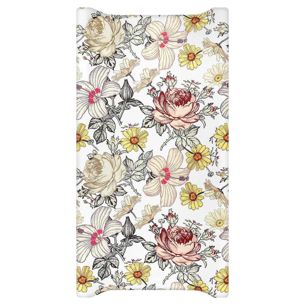HNHUAMING floral changing pad cover on a standard pad provides a soft surface for diaper changes.