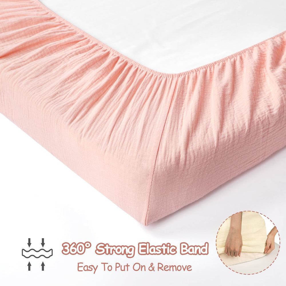 HNHUAMING eight-inch deep pockets with elastic straps secure the crib sheet.