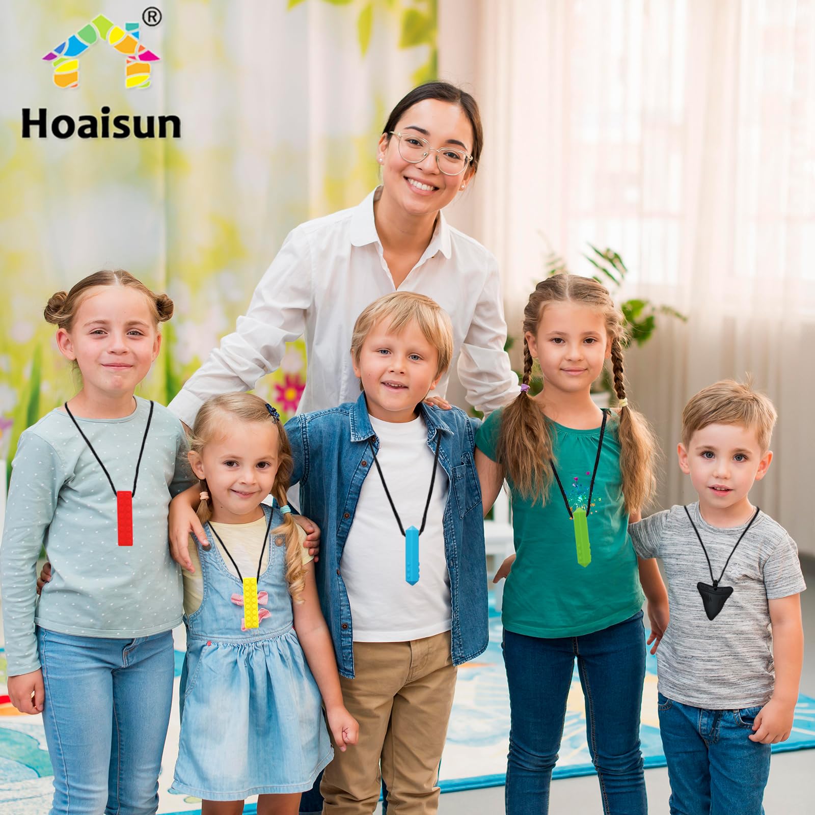 Hoaisun chewy necklace worn by kids and adults for sensory support.