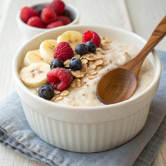 Holle Organic Four Grain Cereal close-up texture shows natural grains.