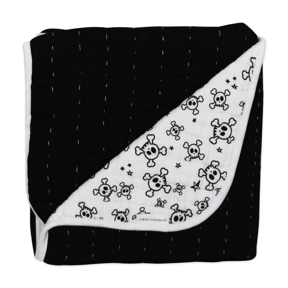 HonestBaby blanket reversible side with print showcases two nursery looks