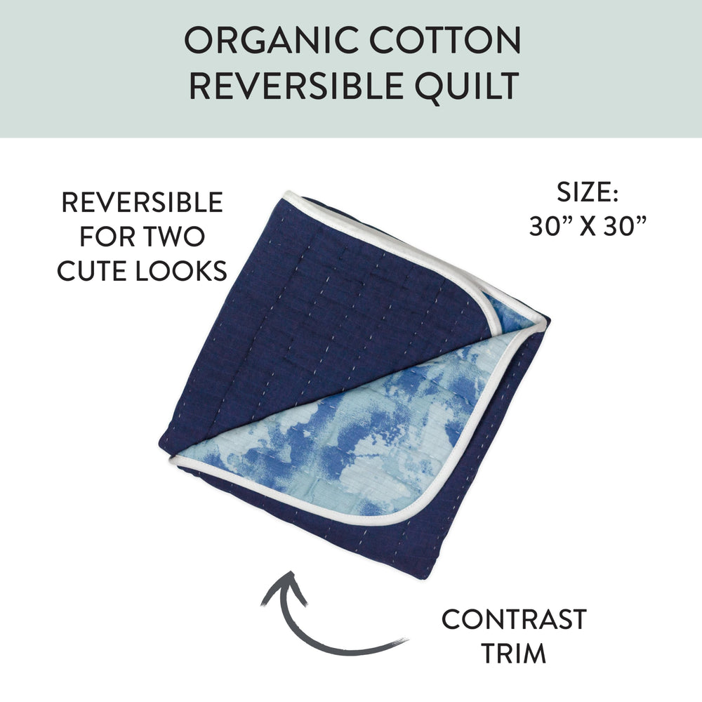 HonestBaby reversible blanket shows print on one side and solid on the other for versatile styling.