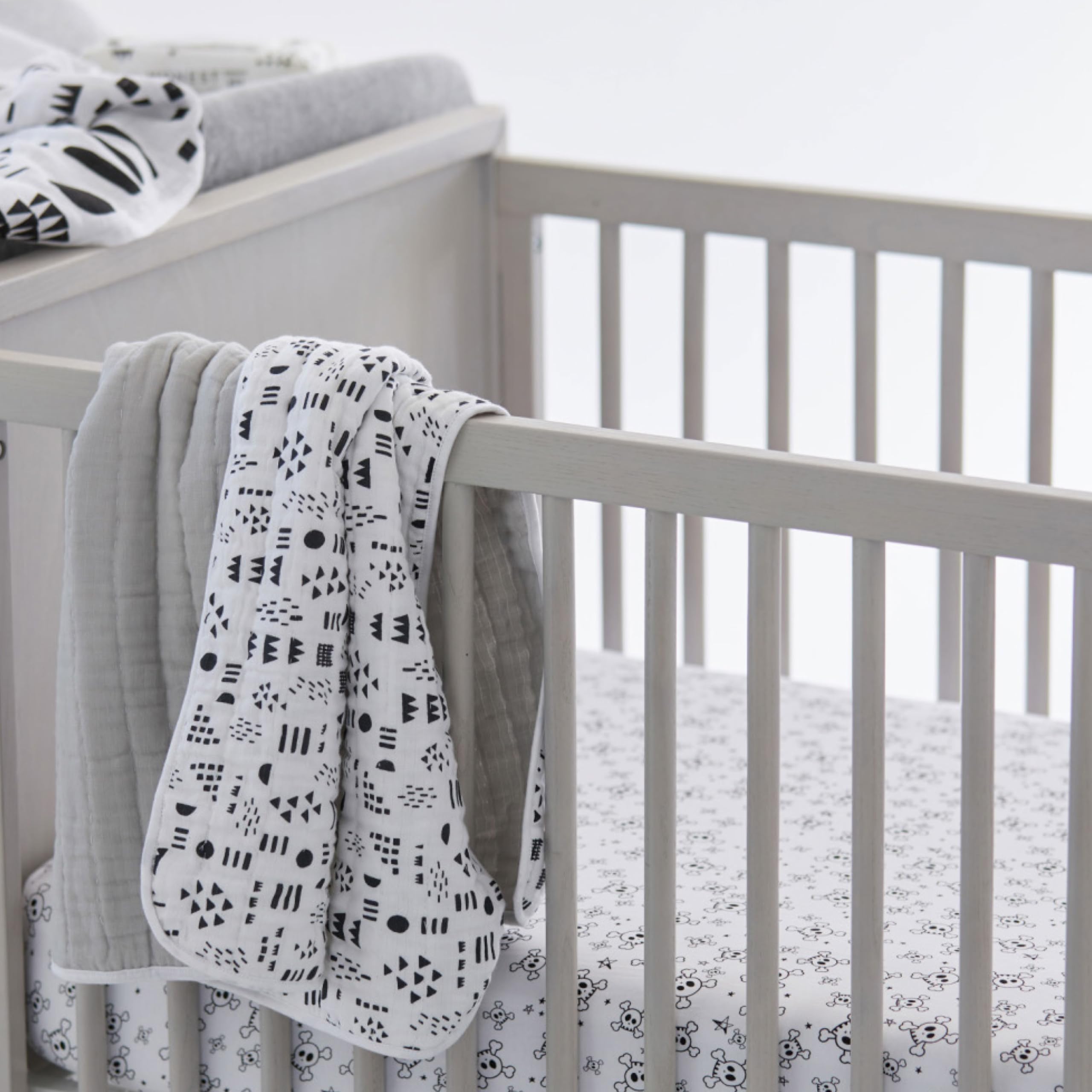 HonestBaby Rose Blossom two-pack sheets laid flat, soft and durable.