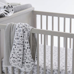 HonestBaby Rose Blossom two-pack sheets laid flat, soft and durable.