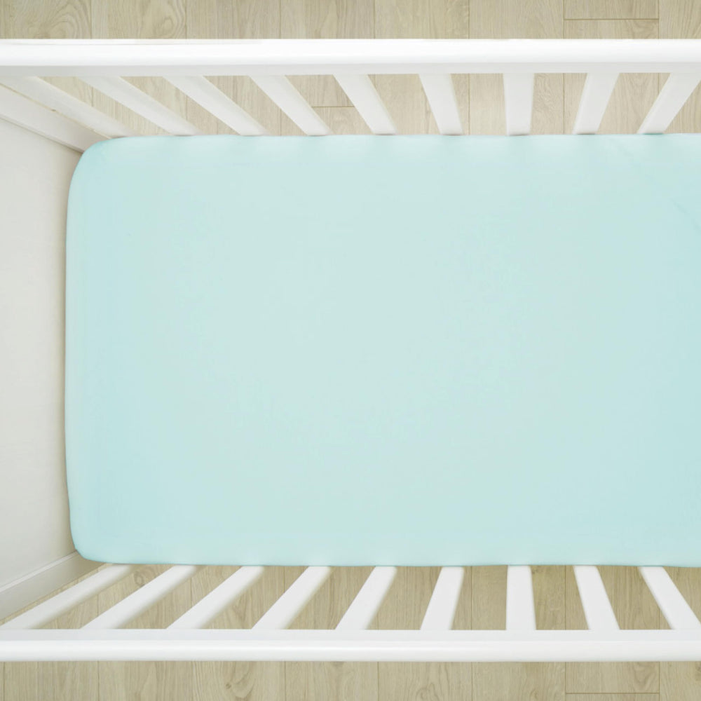 HonestBaby sage crib sheet elastic edge emphasizes snug, stay-put fit during night feedings.