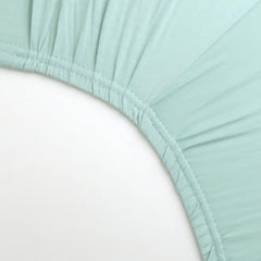 HonestBaby sage crib sheet on standard mattress demonstrates easy care and longevity.
