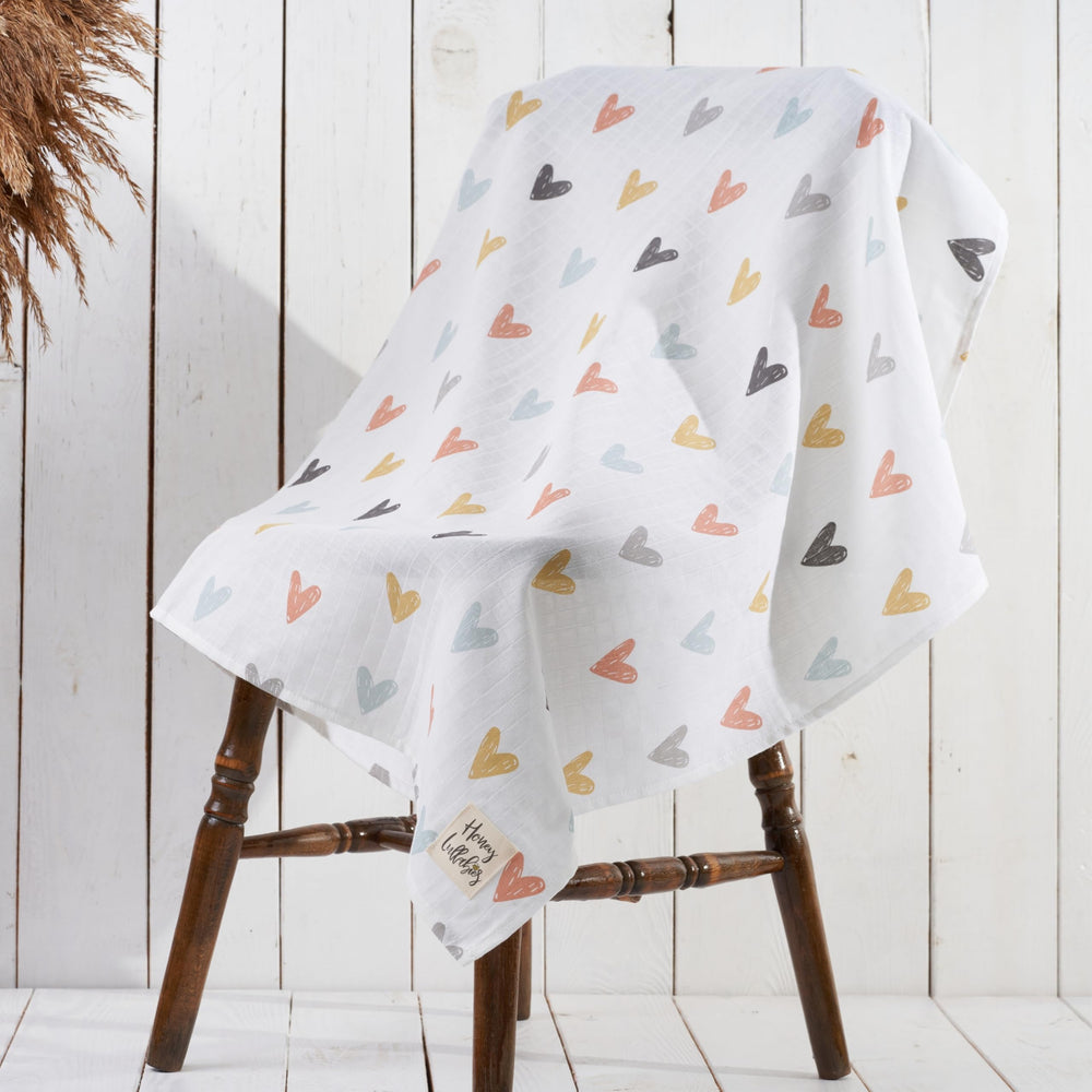 Honey Lullabies muslin blanket pastel hearts pattern adds gentle charm