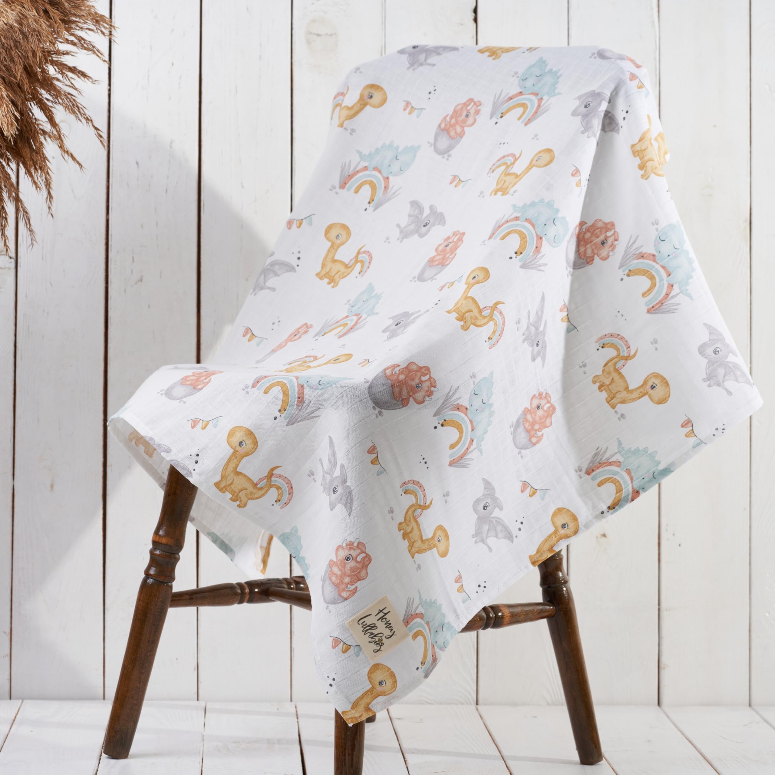 Honey Lullabies blanket shown as swaddle and nursing cover for versatility.