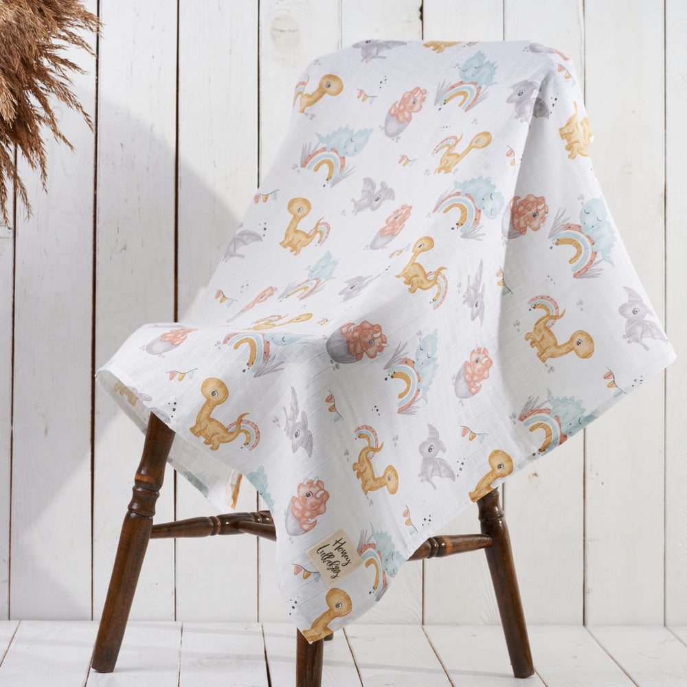 Honey Lullabies blanket shown as swaddle and nursing cover for versatility.