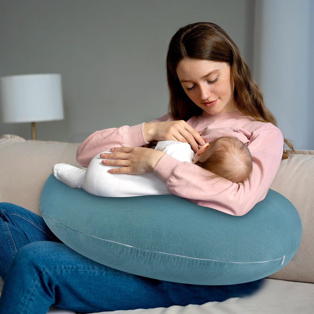 Hooyax blue muslin cover shown on an infant pillow