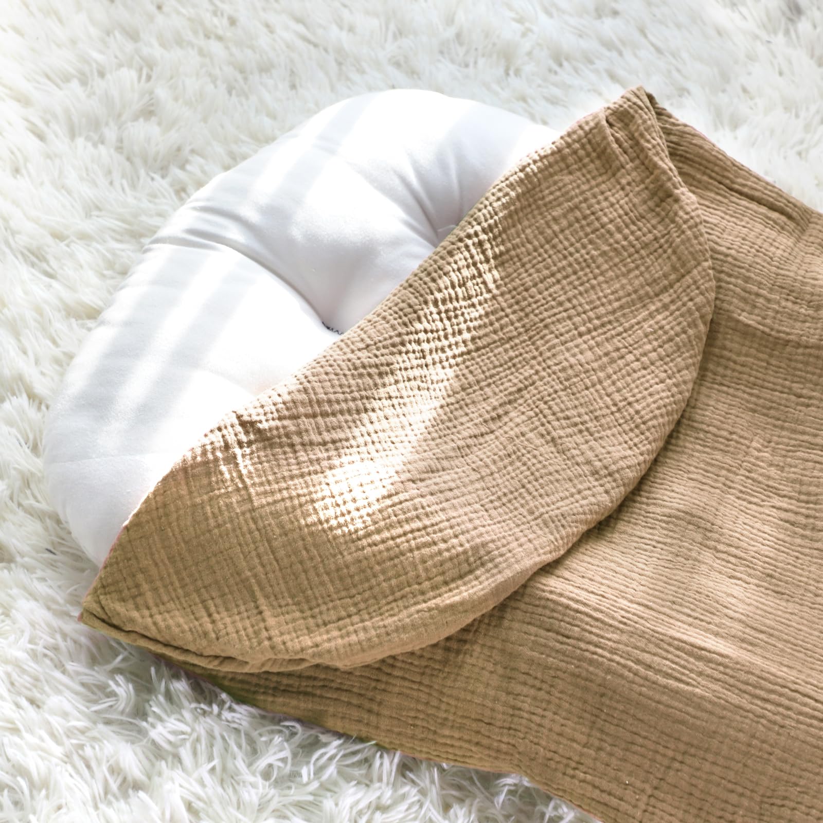 Hooyax brown muslin lounger cover in a natural nursery aesthetic.