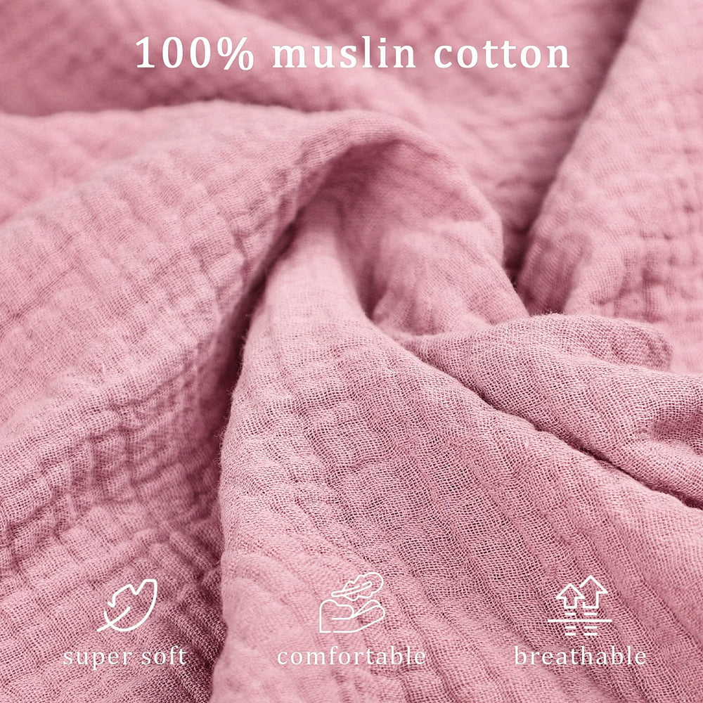 Organic muslin cover by Hooyax offers breathable newborn lounging comfort.