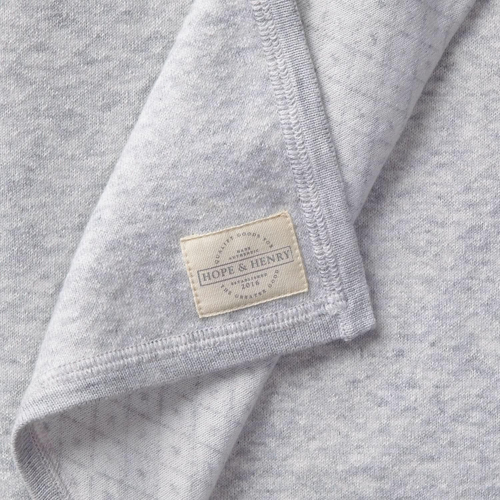 Hope & Henry Baby Jacquard Sweater Blanket folded for compact storage and warmth.