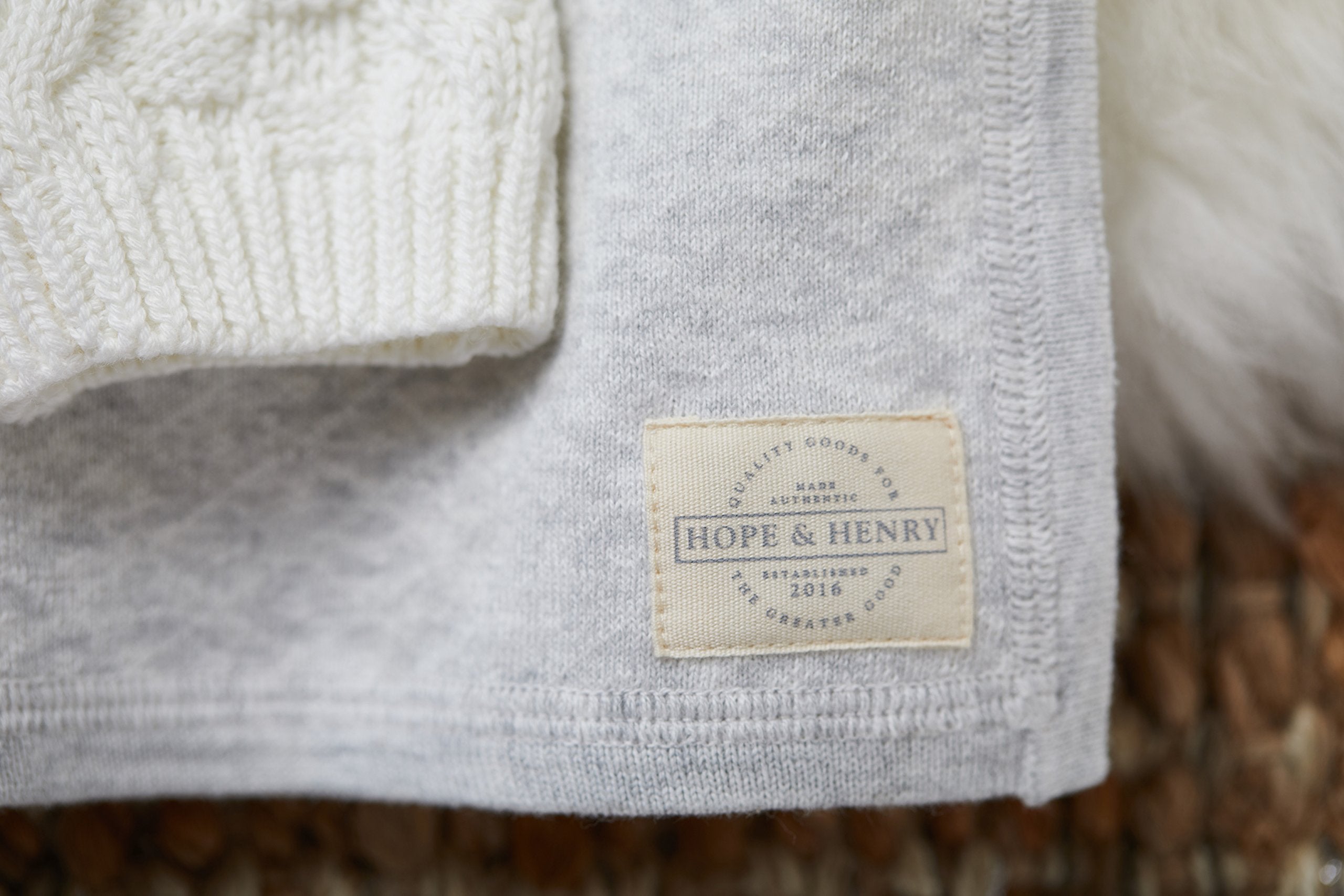 Hope & Henry Baby Jacquard Sweater Blanket in stroller adds gentle warmth.