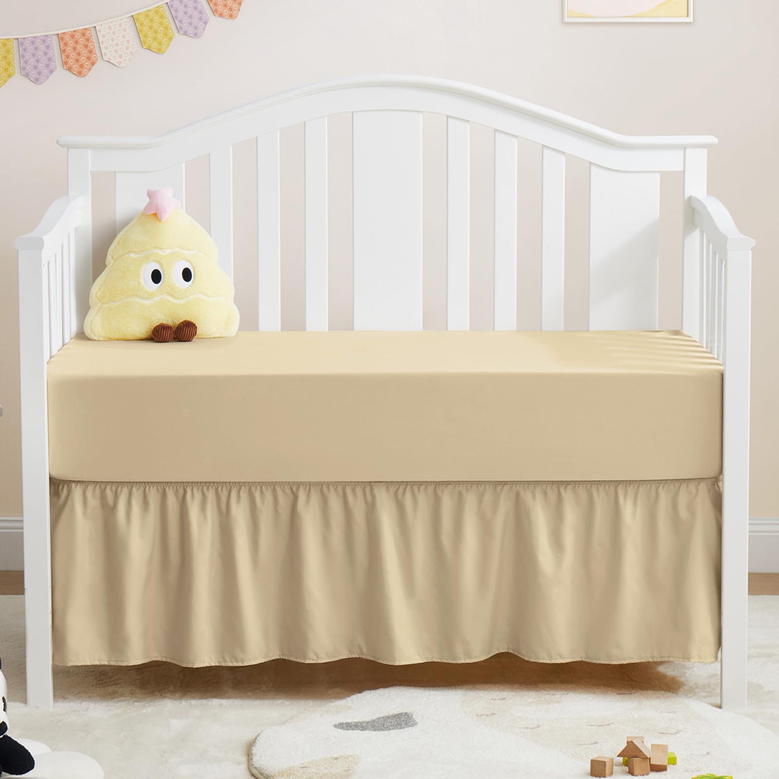 Horbaunal khaki crib skirt with a 14-inch drop concealing space beneath.