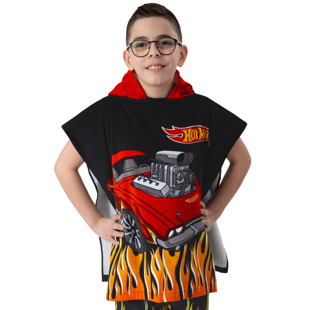 Hot Wheels hooded towel shows red hood keeping kids warm after swimming