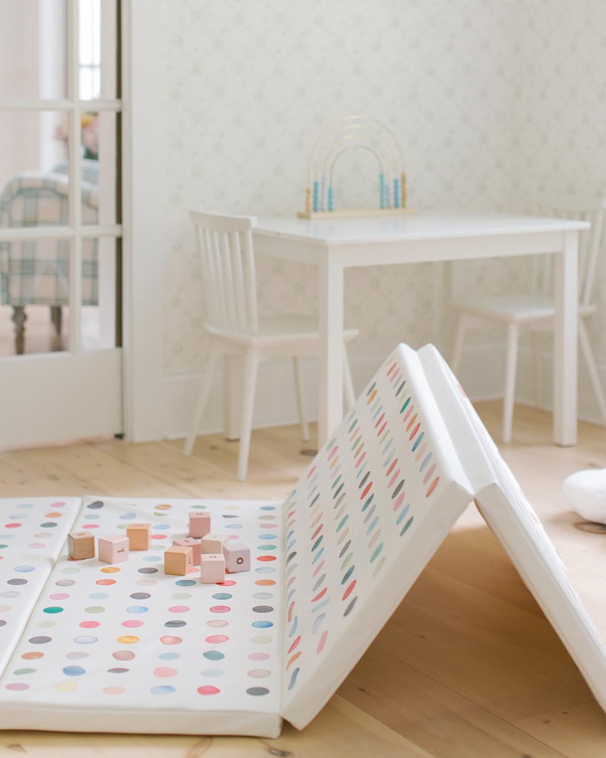 House of Noa cushioned surface offers comfortable floor time indoors.
